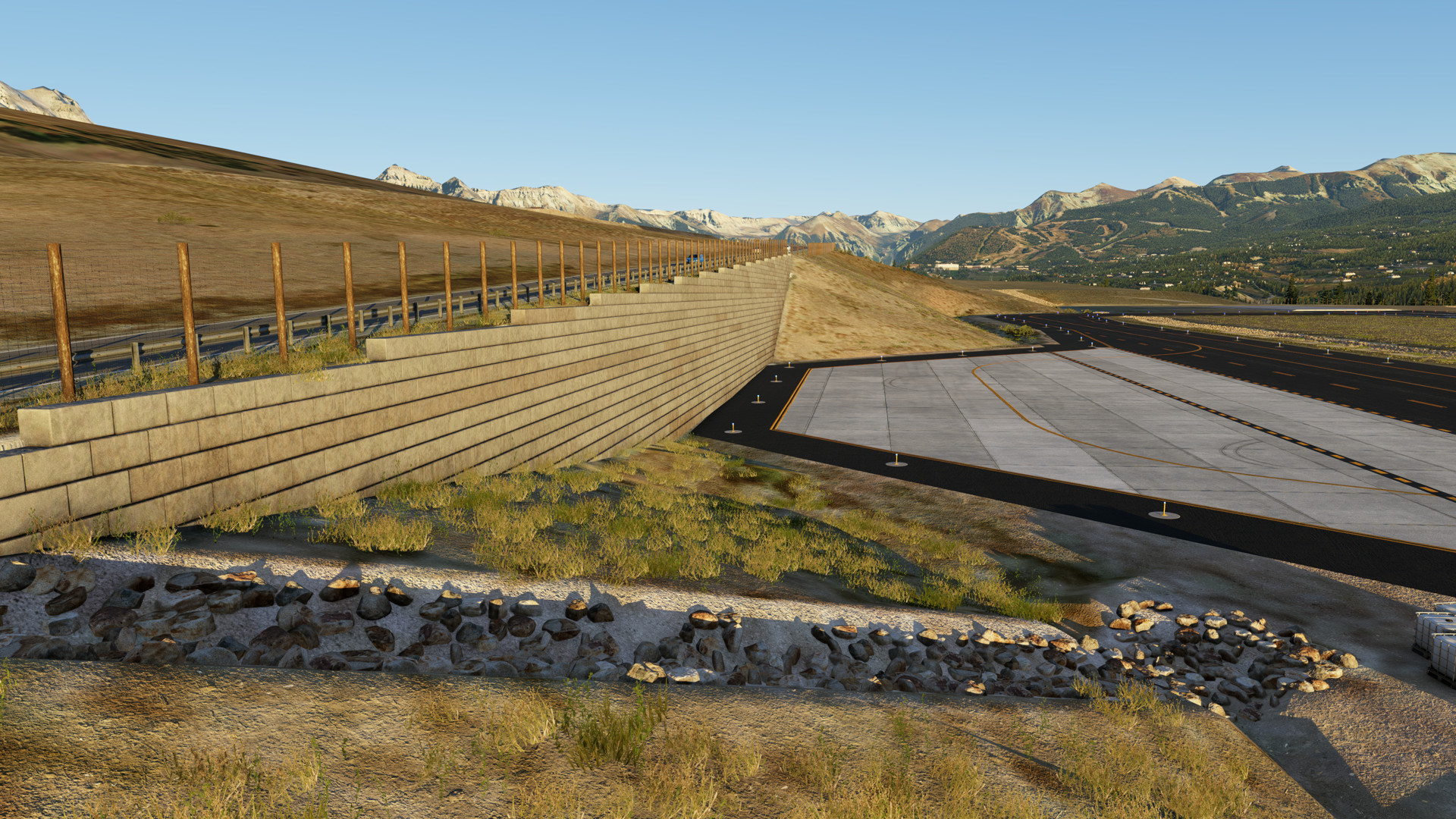Massive gray cast-concrete retaining wall along road at KTEX Telluride Regional Airport in X-Plane 12