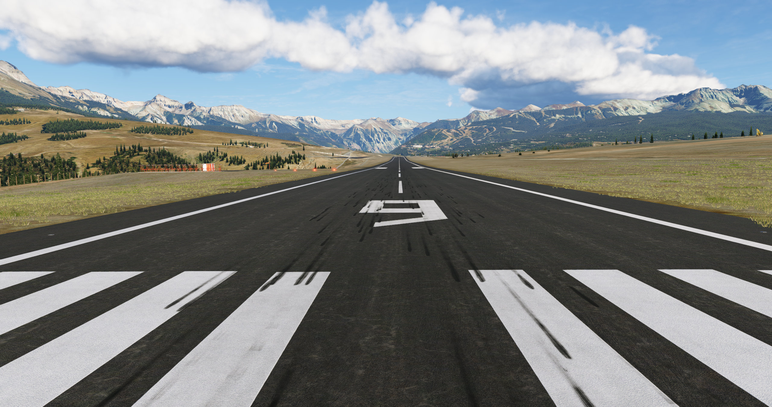 View from the end of runway 9 at KTEX X-Plane 12 showing the skids on the runway and Telluride Ski Resort in the background