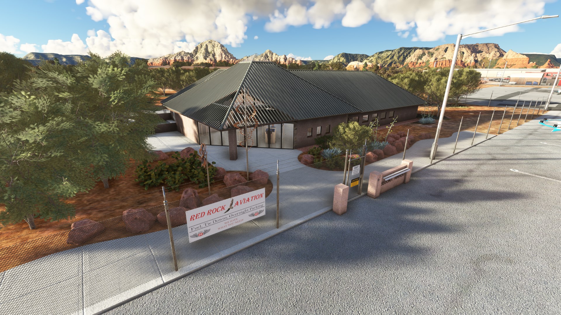 Sedona airport entrance beside red rock scenery for Sedona Airport (KSEZ) by X-Codr Designs in MSFS